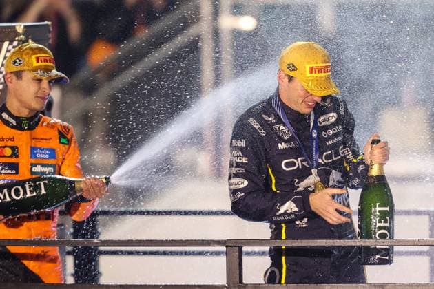 November 22, 2025: McLaren Formula 1 Team, Mercedes driver Lando Norris (4) sprays Oracle Red Bull Racing, Honda RBPT driver Max Verstappen (1) with Moet after winning the Formula One Heineken Las Vegas Grand Prix 2025 on the Las Vegas Street Circuit in Las Vegas, NV. CSM. Las Vegas United States of America - ZUMAc04_ 20251122_zma_c04_504 Copyright: xChristopherxTrimx