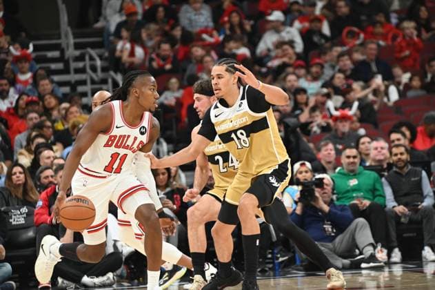 Chicago Bulls v Washington Wizards - NBA, Basketball Herren, USA CHICAGO, UNITED STATES - NOVEMBER 22: Ayo Dosunmu (11) of Chicago Bulls in action against Kyshawn George (18) of Washington Wizards during NBA basketball game between Chicago Bulls and Washington Wizards at the United Center in Chicago, United States on November 22, 2025. Jacek Boczarski Anadolu Chicago United States. Editorial use only. Please get in touch for any other usage.  Copyright: x2025xAnadoluxJacekxBoczarskix