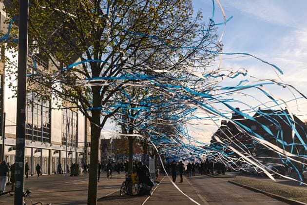 Supporters of the football club arrive at the stadium as white and blue paper streamers fly from the trees prior to the Superliga derby match between FC Copenhagen and Brondby at Parken on November 23, 2025 in Copenhagen, Denmark (Photo by Camilla Stolen Imago) Copenhagen Denmark Copyright: xCamillaxStolenx L1310975