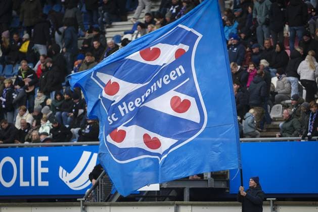 HEERENVEEN , 23-11-2025 , Abe Lenstra Stadium , season 2025 2026 , Dutch Eredivisie football , match between SC Heerenveen - AZ , picture shows fan with flag Heerenveen - AZ  x32154639x Copyright: