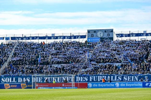 The fans of TSV 1860 Muenchen show a banner against the new security regulations, fans, audience, spectators, mood, atmosphere, stadium, 23 11 2025, Munich Germany , Football, 3 Liga, TSV 1860 München 1 FC Saarbrücken, DFB DFL REGULATIONS PROHIBIT ANY USE OF PHOTOGRAPHS AS IMAGE SEQUENCES AND OR QUASI VIDEO xslx