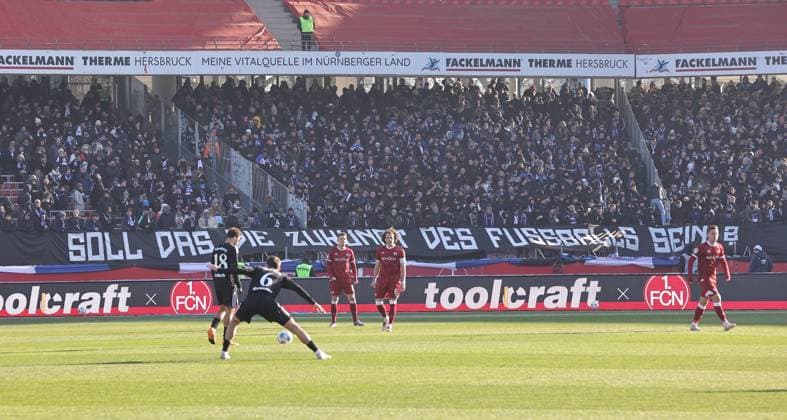 23 11 2025 Football season 2025 2026 2 Football Bundesliga 13 Matchday 1 FC Nürnberg FCN Club DSC Arminia Bielefeld Sportfoto Zink DaMa xdaxmax DFL regulations prohibit any use of photographs as image sequences and or quasi video only for editorial use Banner banner of the spectators audience Fans of Arminia Bielefeld before the start of the match Is this the future of football?