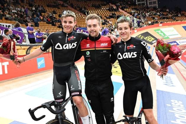 German Tobias Muller, German Theo Reinhardt, coach and German Moritz Mauss celebrate after winning on the last day of the Zesdaagse Vlaanderen-Gent six-day indoor Track cycling, Rad, Radsport, Bahnrad, Bahn event at the indoor cycling arena t Kuipke, Sunday 23 November 2025, in Gent. MAARTENxSTRAETEMANS  x143634779x