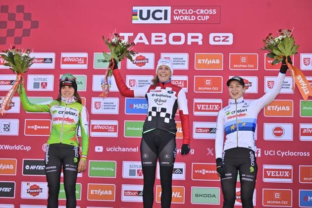 From left: second Sara Casasola from Italy, first Lucinda Brand from Netherlands and third Inge van der Heijden from Netherlands on the podium after the UCI Cyclo-cross World Cup race, category Elite Women, in Tabor, Czech Republic, on November 23, 2025. (CTKxPhoto VaclavxPancer) CTKPhotoP2025112303220  CTKPhotoP2025112303220