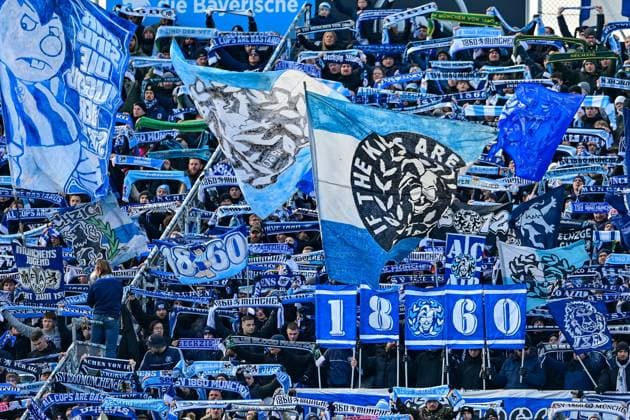 Fans of TSV 1860 Muenchen show their scarves, wave flags and make atmosphere, fans, audience, spectators, mood, atmosphere, stadium, 23 11 2025, Munich Germany , football, 3 Liga, TSV 1860 München 1 FC Saarbrücken, DFB DFL REGULATIONS PROHIBIT ANY USE OF PHOTOGRAPHS AS IMAGE SEQUENCES AND OR QUASI VIDEO xslx