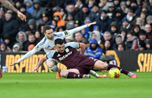 Gabriel Gudmundsson of Leeds United and John McGinn of Aston Villa Leeds United v Aston Villa, Premier League, Football, Elland Road, Leeds, UK - 23 Nov 2025Leeds Elland Road United Kingdom EDITORIAL USE ONLY No use with unauthorised audio, video, data, fixture lists, club league logos or live services. Online in-match use limited to 120 images, no video emulation. No use in betting, games or single club league player publications.  Copyright: xAnnaxGowthorpe Shutterstockx 15860945y