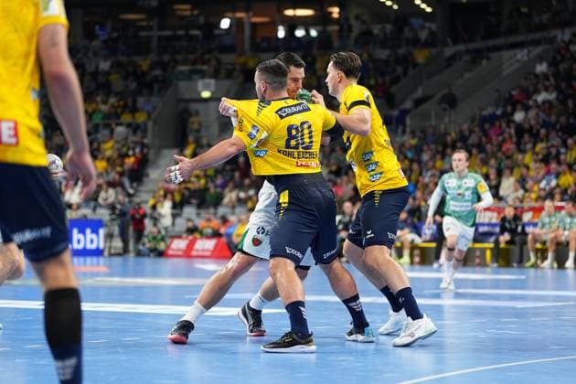 Jannik Kohlbacher 80 Rhein Neckar Löwen and Mathias Gidsel 19 Füchse Berlin fight for the ball in defense 1 Handball Bundesliga Rhein Neckar Löwen vs Füchse Berlin 23 11 2025 Copyright: xSpeedshotx