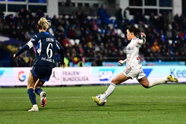 Linda Dallmann 10 FC Bayern Munich shoots the ball while Vanessa Diehm 6 TSG Hoffenheim Women defends ball action and defense Copyright: xspeedshotx