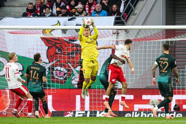 Goalkeeper Mio Backhaus Werder Bremen,30 vs Christoph Baumgartner RB Leipzig,14 1 Soccer Bundesliga Season 2025 2026 Point Match RB Leipzig vs Werder Bremen at the Red Bull Arena in Leipzig Action,Soccer,Germany,Man,Men,23 11 2025