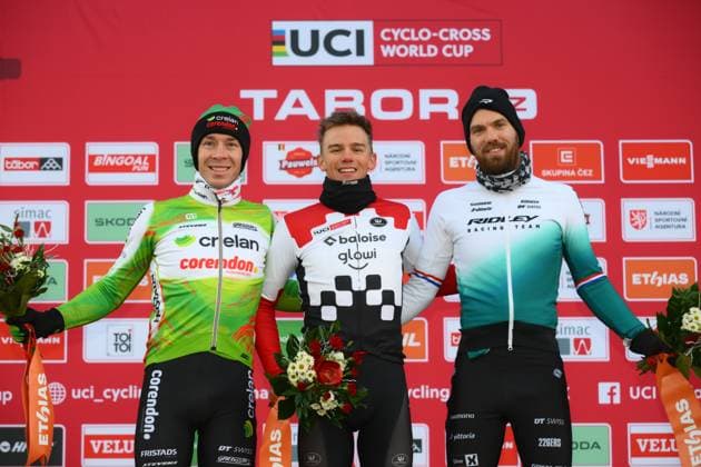 L-R, second Belgian Laurens Sweeck, winner Belgian Thibau Nys and third Dutch Joris Nieuwenhuis celebrate on the podium of the men elite race at the World Cup cyclocross cycling event in Tabor, Czech Republic, stage 1 (out of 12) of the UCI World Cup cyclocross competition, Sunday 23 November 2025. DAVIDxPINTENS  x143654193x