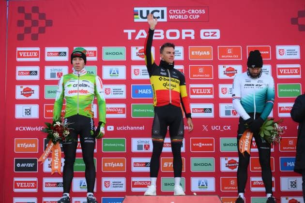 L-R, second Belgian Laurens Sweeck, winner Belgian Thibau Nys and third Dutch Joris Nieuwenhuis celebrate on the podium of the men elite race at the World Cup cyclocross cycling event in Tabor, Czech Republic, stage 1 (out of 12) of the UCI World Cup cyclocross competition, Sunday 23 November 2025. DAVIDxPINTENS  x143654369x