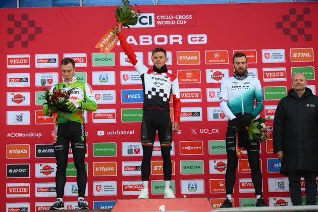 L-R, second Belgian Laurens Sweeck, winner Belgian Thibau Nys and third Dutch Joris Nieuwenhuis celebrate on the podium of the men elite race at the World Cup cyclocross cycling event in Tabor, Czech Republic, stage 1 (out of 12) of the UCI World Cup cyclocross competition, Sunday 23 November 2025. DAVIDxPINTENS  x143654405x