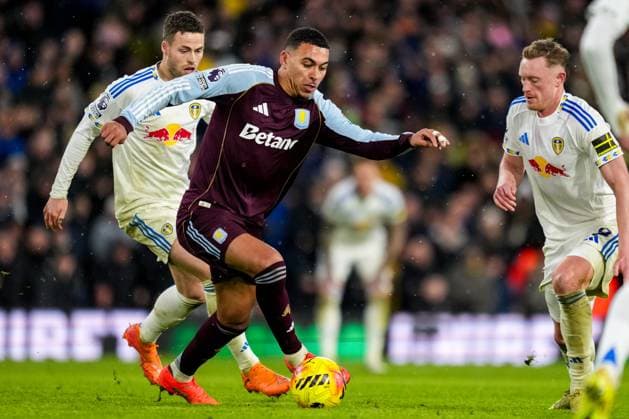 LEEDS, ENGLAND - NOVEMBER 23: Morgan Rogers of Aston Villa is challenged by Sean Longstaff of Leeds United during the Premier League match between Leeds United and Aston Villa at Elland Road on November 23, 2025 in Leeds, England. (Photo by Rene Nijhuis) SPO  Copyright: xRenexNijhuis