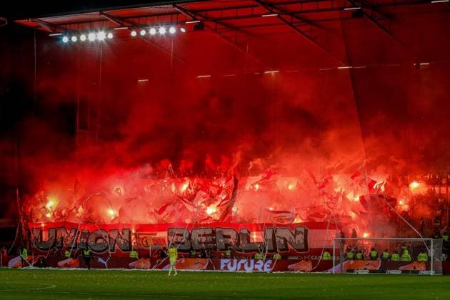 Union fans with banner flags fans fan block pyro fire pyrotechnics flares Germany , Hamburg , Millerntorstadion , Football , 1 Bundesliga , FC St Pauli 1 FC Union Berlin