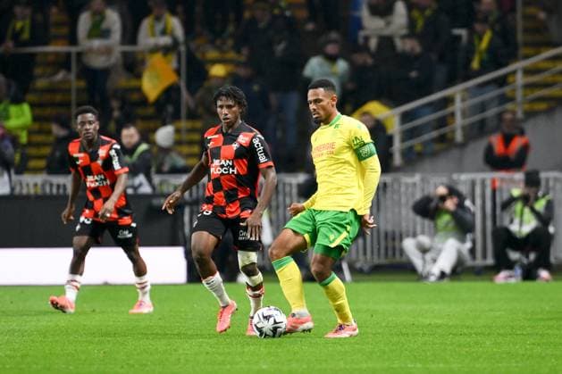 FC Nantes v FC Lorient - Ligue 1 McDonald s 2025 2026 29 Karim DERMANE (fcl) - 98 Kelvin AMIAN (fcn) during the Ligue 1 McDonald s match between Nantes and Lorient at Stade de la Beaujoire on November 23, 2025 in Nantes, France. Nantes France  Copyright: xFEPx 776348203