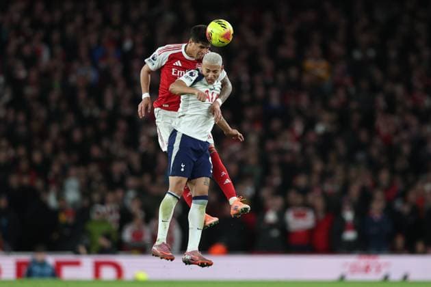 London, England, 23rd November 2025. Piero Hincapie of Arsenal and Richarlison of Tottenham Hotspur challenge for the ball during the Arsenal vs Tottenham Hotspur Premier League match at the Emirates Stadium, London. Picture credit should read: David Klein Sportimage EDITORIAL USE ONLY. No use with unauthorised audio, video, data, fixture lists, club league logos or live services. Online in-match use limited to 120 images, no video emulation. No use in betting, games or single club league player publications. SPI_101_DK_Arsenal_Tottenham SPI-4307-0100