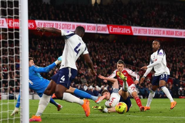 Leandro Trossard of Arsenal scores a goal to make it 1-0 - Arsenal v Tottenham Hotspur, Premier League, Emirates Stadium, London, UK - 23rd November 2025 Editorial Use Only - DataCo restrictions apply Arsenal v Tottenham Hotspur, Premier League, Football, Emirates Stadium, London, UK - 23 Nov 2025London Emirates Stadium United Kingdom EDITORIAL USE ONLY No use with unauthorised audio, video, data, fixture lists, club league logos or live services. Online in-match use limited to 120 images, no video emulation. No use in betting, games or single club league player publications.  Copyright: xMDI Shutterstockx 15874294d