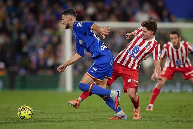 Domingos Duarte Getafe CF and Julian Alvarez Atletico de Madrid battle for the ball during the LaLiga EA Sports match between Getafe CF v AtlÃ tico Madrid at Coliseum on November 23, 2025 in Getafe, Spain Photo by Manu Reino DeFodi Images