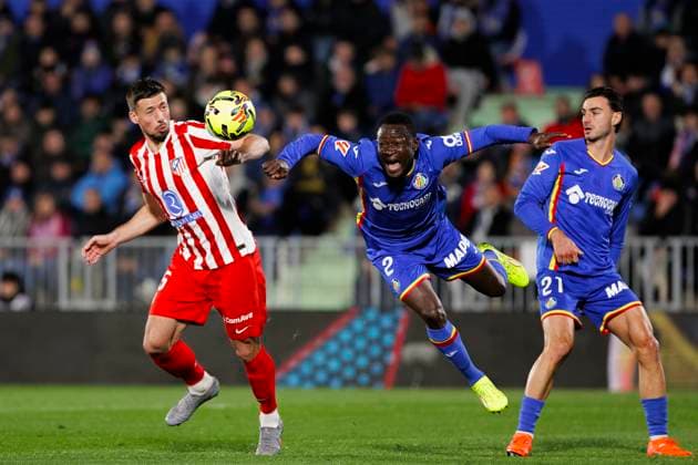 LA LIGA EA Sports - Getafe v Atletico de Madrid MADRID, SPAIN - November23:Djene Dakonam of Getafe and Clement Lenglet of Atletico de Madrid fight for the ball during the La Liga 2024 25 match between Getafe and Atletico de Madrid at Coliseum Stadium. (Photo by Guillermo Martinez) Getafe Coliseum Stadium Spain Copyright: xGuillermoxMartinezx