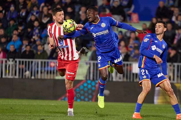 Clement Lenglet Atletico de Madrid and Dakonam Ortega Djene Getafe CF battle for the ball during the LaLiga EA Sports match between Getafe CF v AtlÃ tico Madrid at Coliseum on November 23, 2025 in Getafe, Spain Photo by Manu Reino DeFodi Images