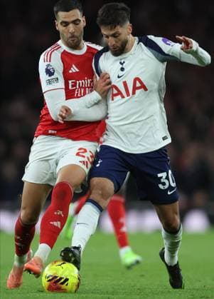 Arsenal v Tottenham Hotspur - Premier League Mikel Merino of Arsenal and Rodrigo Bentancur of Tottenham Hotspur challenge during the Premier League match between Arsenal and Tottenham Hotspur at Emirates Stadium on November 23, 2025 in London, England. London Emirates Stadium England United Kingdom Copyright: xNigelxFrench Sportsphoto APLx 14142510