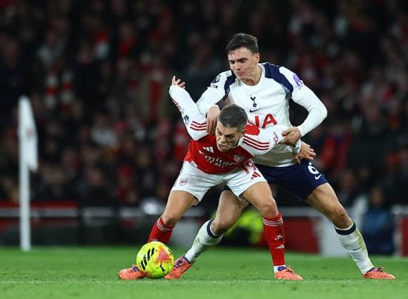Joao Palhinha of Tottenham Hotspur competes for the ball with Leandro Trossard of Arsenal Arsenal v Tottenham Hotspur, Premier League, Football, Emirates Stadium, London, UK - 23 Nov 2025London Emirates Stadium United Kingdom EDITORIAL USE ONLY No use with unauthorised audio, video, data, fixture lists, club league logos or live services. Online in-match use limited to 120 images, no video emulation. No use in betting, games or single club league player publications.  Copyright: xMichaelxZemanek Shutterstockx 15860967bd
