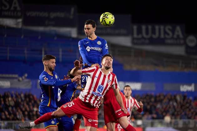 Juan Iglesias Getafe CF and Clement Lenglet Atletico de Madrid battle for the ball during the LaLiga EA Sports match between Getafe CF v AtlÃ tico Madrid at Coliseum on November 23, 2025 in Getafe, Spain Photo by Manu Reino DeFodi Images