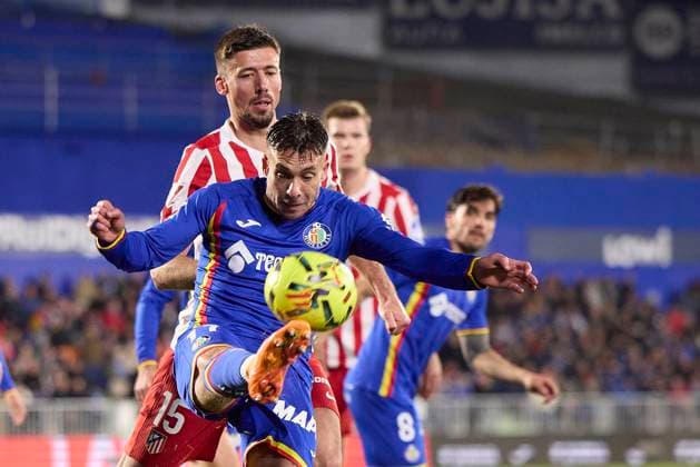 Kiko Femenia Getafe CF and Clement Lenglet Atletico de Madrid battle for the ball during the LaLiga EA Sports match between Getafe CF v AtlÃ tico Madrid at Coliseum on November 23, 2025 in Getafe, Spain Photo by Manu Reino DeFodi Images