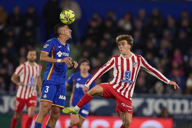 Abdel Abra Getafe CF and Pablo Barrios Atletico de Madrid battle for the ball during the LaLiga EA Sports match between Getafe CF v AtlÃ tico Madrid at Coliseum on November 23, 2025 in Getafe, Spain Photo by Manu Reino DeFodi Images