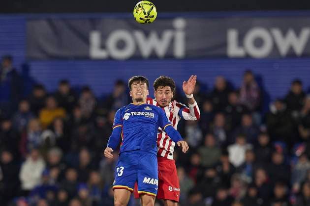 Adrian Liso Getafe CF and Jose Maria Gimenez Atletico de Madrid battle for the ball during the LaLiga EA Sports match between Getafe CF v AtlÃ tico Madrid at Coliseum on November 23, 2025 in Getafe, Spain Photo by Manu Reino DeFodi Images