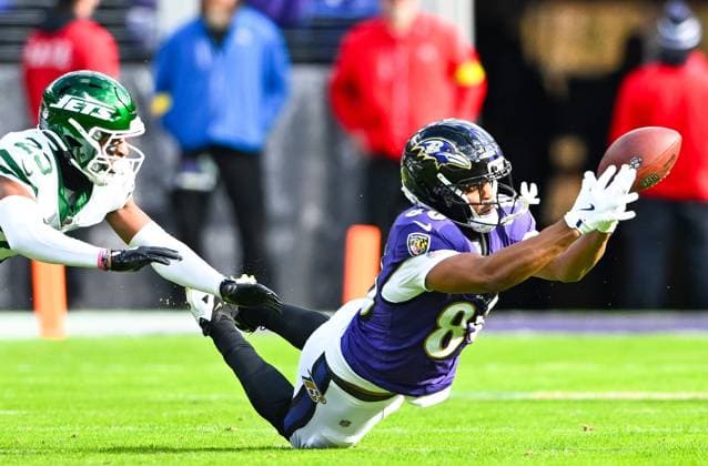 New York Jets cornerback Azareye h Thomas (23) blocks an attempted pass to Baltimore Ravens tight end Isaiah Likely (80) to bring up fourth down during the first quarter at M&T Bank Stadium in Baltimore, Maryland, on Sunday, November 23, 2025.  BAL20251123113 DAVIDxTULIS