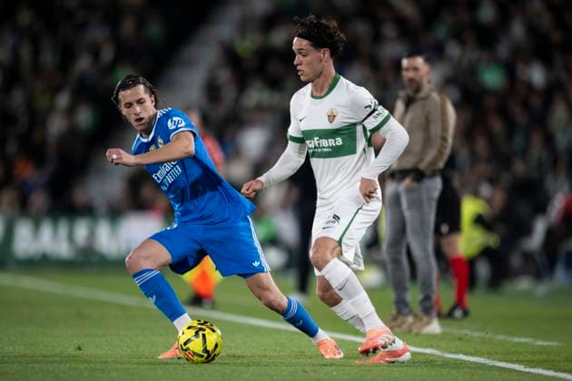 November 23, 2025, Elche, Alicante, SPAIN: Hector Fort of Elche CF and Alvaro Carreras of Real Madrid CF in action during the Spanish league, La Liga EA Sports, football match played between Elche CF and Real Madrid C.F. at Manuel Martinez Valero Stadium on November 23, 2025 in Elche, Spain. Elche SPAIN - ZUMAa181 20251123_zaa_a181_282 Copyright: xFranciscoxMaciax
