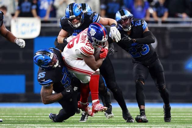 New York Giants vs Detroit Lions DETROIT,MICHIGAN-November23: Running back Devin Singletary (26) of the New York Giants is tackled by linebacker Jack Campbell (46) of the Detroit Lions, cornerback Rock Ya-Sin (23) of the Detroit Lions, and linebacker Derrick Barnes (55) of the Detroit Lions in overtime during an NFL, American Football Herren, USA football game between the New York Giants and the Detroit Lions in Detroit, Michigan USA, on Sunday, November 23, 2025. Detroit Michigan United States  Copyright: xAmyxLemusx originalFilename:lemus-newyorkg251123_npAjH.jpg