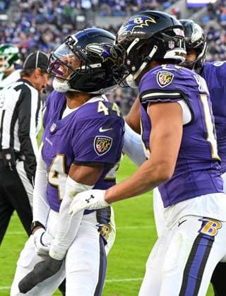 Baltimore Ravens cornerback Marlon Humphrey (44) and safety Kyle Hamilton (R) celebrate a fumble by New York Jets running back Breece Hall that Humphrey recovered on the 3 yard line during the fourth quarter at M&T Bank Stadium in Baltimore, Maryland, on Sunday, November 23, 2025. Baltimore won 23-10.  BAL20251123125 DAVIDxTULIS