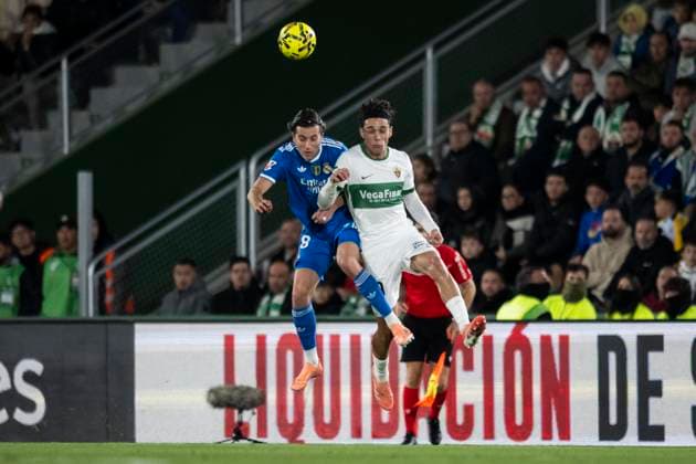November 23, 2025, Elche, Alicante, SPAIN: Hector Fort of Elche CF and Alvaro Carreras of Real Madrid CF compete for the ball during the Spanish league, La Liga EA Sports, football match played between Elche CF and Real Madrid C.F. at Manuel Martinez Valero Stadium on November 23, 2025 in Elche, Spain. Elche SPAIN - ZUMAa181 20251123_zaa_a181_340 Copyright: xFranciscoxMaciax