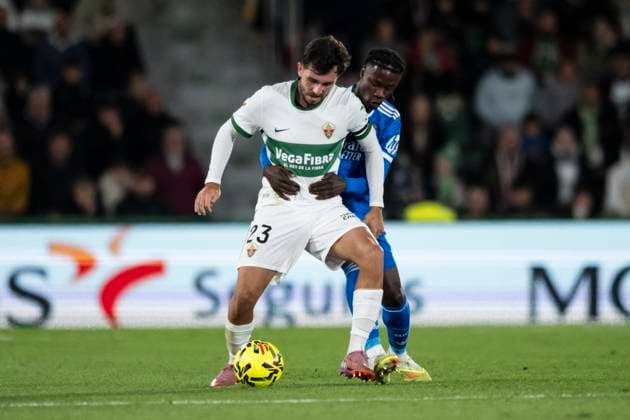 November 23, 2025, Elche, Alicante, SPAIN: Victor Chust of Elche CF and Eduardo Camavinga of Real Madrid CF compete for the ball during the Spanish league, La Liga EA Sports, football match played between Elche CF and Real Madrid C.F. at Manuel Martinez Valero Stadium on November 23, 2025 in Elche, Spain. Elche SPAIN - ZUMAa181 20251123_zaa_a181_346 Copyright: xFranciscoxMaciax