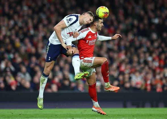 Micky van de Ven of Tottenham Hotspur competes for the ball with Mikel Merino of Arsenal Arsenal v Tottenham Hotspur, Premier League, Football, Emirates Stadium, London, UK - 23 Nov 2025London Emirates Stadium United Kingdom EDITORIAL USE ONLY No use with unauthorised audio, video, data, fixture lists, club league logos or live services. Online in-match use limited to 120 images, no video emulation. No use in betting, games or single club league player publications.  Copyright: xMichaelxZemanek Shutterstockx 15860967ca