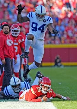 Indianapolis Colts defensive end Tyquan Lewis (94) leaps to avoid Kansas City Chiefs quarterback Patrick Mahomes (15) after a sack by Indianapolis Colts defensive tackle Neville Gallimore (92) at Arrowhead Stadium in Kansas City, Missouri on Sunday, November 23, 2025.  KCP2025112321 JONxROBICHAUD