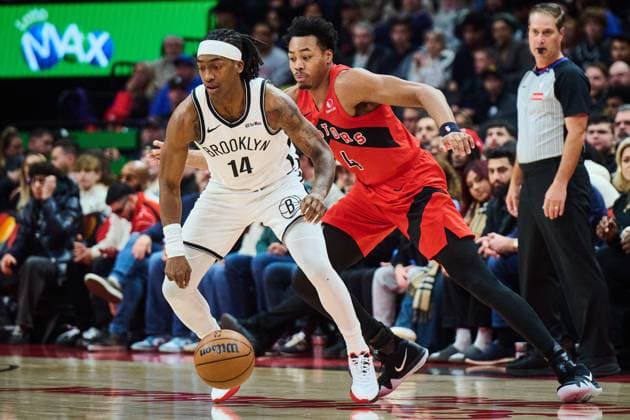 November 23, 2025, Toronto, On, Canada: Brooklyn Nets Terance Mann (14) drives past Toronto Raptors Scottie Barnes (4) during first half NBA, Basketball Herren, USA basketball action in Toronto, on Sunday, Nov. 23, 2025. Canada News - November 23, 2025  - ZUMAc35_ 20251123_zaf_c35_108 Copyright: xSammyxKoganx