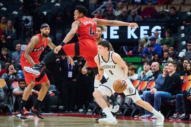 November 23, 2025, Toronto, On, Canada: Brooklyn Nets Egor DoÂ«min (8) drives past Toronto Raptors Scottie Barnes (4) during first half NBA, Basketball Herren, USA basketball action in Toronto, on Sunday, Nov. 23, 2025. Canada News - November 23, 2025  - ZUMAc35_ 20251123_zaf_c35_113 Copyright: xSammyxKoganx