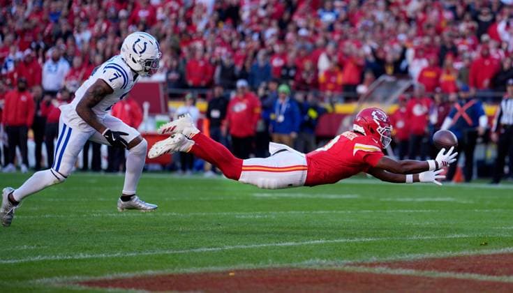 Kansas City Chiefs wide receiver Juju Smith-Schuster (9) lays out for a catch attempt in the end zone against Indianapolis Colts cornerback Charvarius Ward (7) at Arrowhead Stadium in Kansas City, Missouri on Sunday, November 23, 2025.  KCP2025112329 JONxROBICHAUD