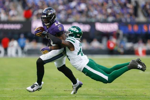 November 23, 2025: Baltimore Ravens running back Derrick Henry (22) is tackled by New York Jets linebacker Jamien Sherwood (44) during the first half of a game at M&T Bank Stadium in Baltimore, MD. Photo Mike Buscher Cal Media. Baltimore USA - ZUMAc04_ 20251123_zma_c04_468 Copyright: xMikexBuscher CalxSportxMediax