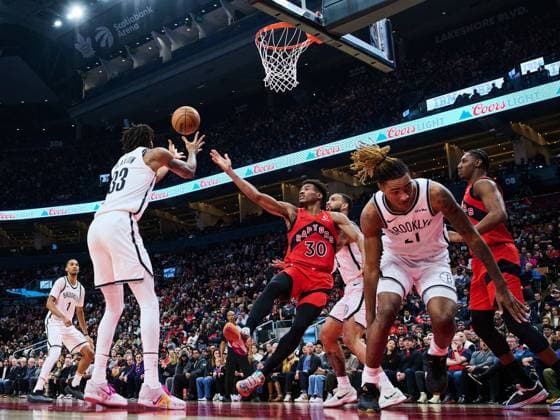 November 23, 2025, Toronto, On, Canada: Brooklyn Nets Nic Claxton (33) and Toronto Raptors Ochai Agbaji (30) vie for control of the ball during first half NBA, Basketball Herren, USA basketball action in Toronto, on Sunday, Nov. 23, 2025. Canada News - November 23, 2025  - ZUMAc35_ 20251123_zaf_c35_130 Copyright: xSammyxKoganx