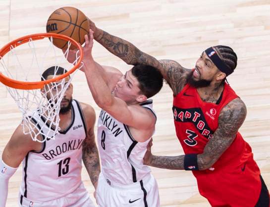 (251124) -- TORONTO, Nov. 24, 2025 -- Brandon Ingram (R) of Toronto Raptors fights for a rebound with Egor Demin (C) of Brooklyn Nets during the 2025-2026 NBA, Basketball Herren, USA regular season game between Toronto Raptors and Brooklyn Nets in Toronto, Canada, on Nov. 23, 2025. (Photo by Xinhua) (SP)CANADA-TORONTO-BASKETBALL-NBA-NETS VS RAPTORS ZouxZheng 