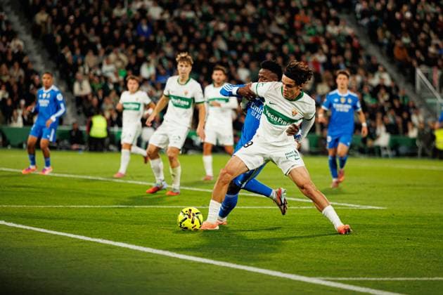 November 23, 2025, Elche, Spain: Vinicius Vini Junior (Real Madrid FC) and Hector Fort Garcia (Elche CF) seen in action during the LaLiga EA SPORTS game between teams of Elche CF and Real Madrid FC at Estadio Manuel Martinez Valero. Final score; Elche CF 2:2 Real Madrid FC Elche Spain - ZUMAs197 20251123_aaa_s197_192 Copyright: xMaciejxRogowskix