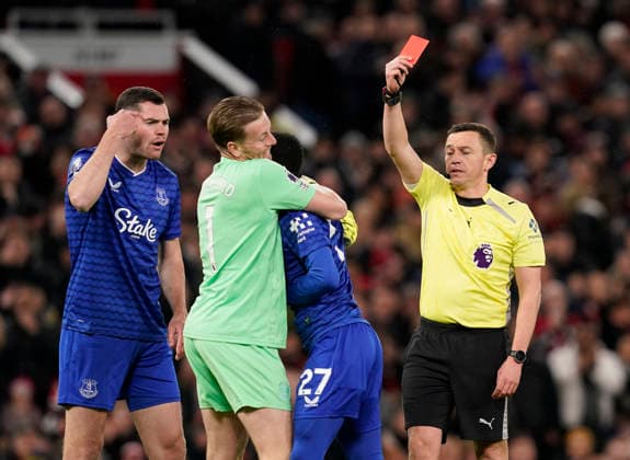 Manchester, England, 24th November 2025. Jordan Pickford of Everton holds back Idrissa Gueye of Everton after he clashes with his own teammate Michael Keane of Everton (l) leading to his dismissal during the Manchester United, ManU vs Everton Premier League match at Old Trafford, Manchester. Picture credit should read: Andrew Yates Sportimage EDITORIAL USE ONLY. No use with unauthorised audio, video, data, fixture lists, club league logos or live services. Online in-match use limited to 120 images, no video emulation. No use in betting, games or single club league player publications. SPI_035_AY_Manchester_Utd_Everton SPI-4308-0034