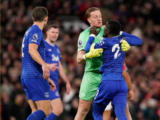 Manchester, England, 24th November 2025. Jordan Pickford of Everton holds back red carded Idrissa Gueye of Everton following a clash with Michael Keane of Everton during the Manchester United, ManU vs Everton Premier League match at Old Trafford, Manchester. Picture credit should read: Andrew Yates Sportimage EDITORIAL USE ONLY. No use with unauthorised audio, video, data, fixture lists, club league logos or live services. Online in-match use limited to 120 images, no video emulation. No use in betting, games or single club league player publications. SPI_039_AY_Manchester_Utd_Everton SPI-4308-0038