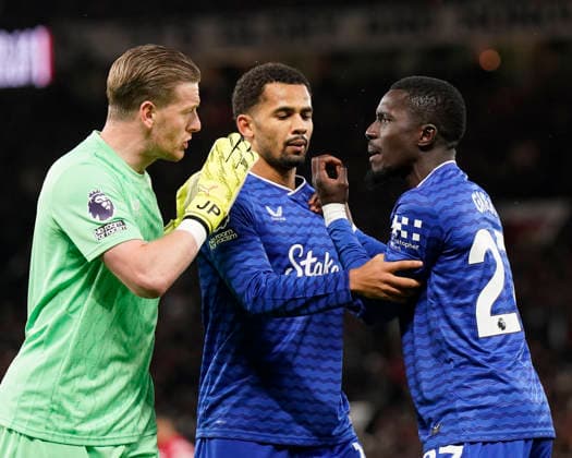 Manchester, England, 24th November 2025. Jordan Pickford of Everton (l) and Iliman Ndiaye of Everton (r) holds back red carded Idrissa Gueye of Everton following a clash with Michael Keane of Everton during the Manchester United, ManU vs Everton Premier League match at Old Trafford, Manchester. Picture credit should read: Andrew Yates Sportimage EDITORIAL USE ONLY. No use with unauthorised audio, video, data, fixture lists, club league logos or live services. Online in-match use limited to 120 images, no video emulation. No use in betting, games or single club league player publications. SPI_041_AY_Manchester_Utd_Everton SPI-4308-0040
