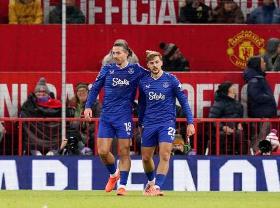 Manchester, England, 24th November 2025. Jack Grealish of Everton celebrates with scorer Kiernan Dewsbury-Hall of Everton (r) celebrates scoring the first goal during the Manchester United, ManU vs Everton Premier League match at Old Trafford, Manchester. Picture credit should read: Andrew Yates Sportimage EDITORIAL USE ONLY. No use with unauthorised audio, video, data, fixture lists, club league logos or live services. Online in-match use limited to 120 images, no video emulation. No use in betting, games or single club league player publications. SPI_049_AY_Manchester_Utd_Everton SPI-4308-0048