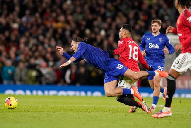 Manchester, England, 24th November 2025. Jack Grealish of Everton (l) is checked by Casemiro of Manchester United, ManU (r) during the Manchester United vs Everton Premier League match at Old Trafford, Manchester. Picture credit should read: Andrew Yates Sportimage EDITORIAL USE ONLY. No use with unauthorised audio, video, data, fixture lists, club league logos or live services. Online in-match use limited to 120 images, no video emulation. No use in betting, games or single club league player publications. SPI_070_AY_Manchester_Utd_Everton SPI-4308-0065